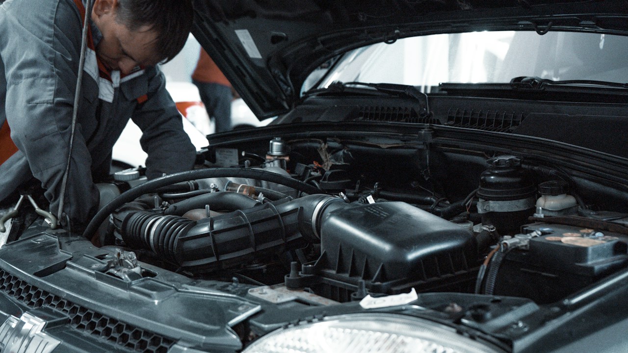 Inspecting Engine Bay After Running Low on Motor Oil